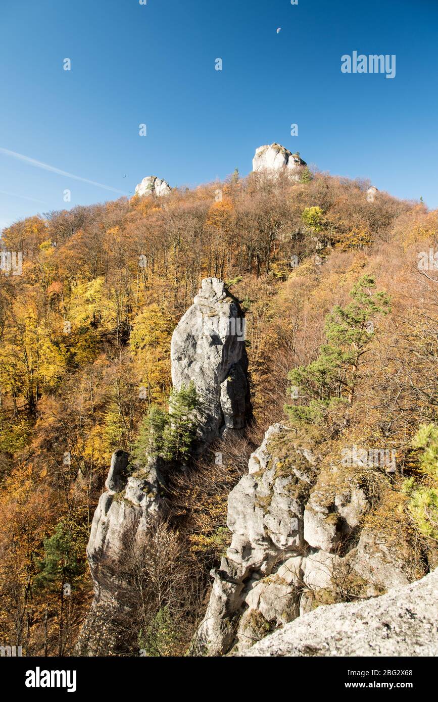 autumn Sulovske skaly mountains from Vyhliadka Opasana above Sulov village in Slovakia with rocks, colorful forest and clear sky Stock Photo