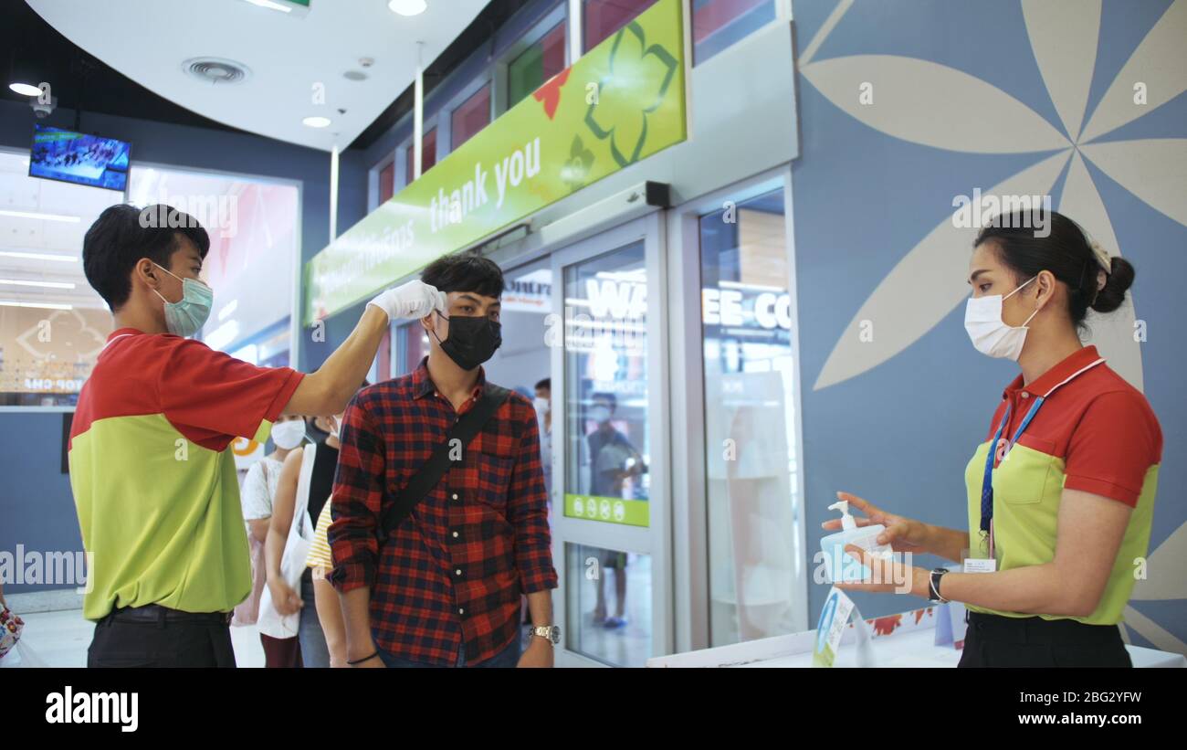 Temperature Check Commercial PATTAYA, THAILAND - MARCH 20, 2020: Temperature check at supermarket ...