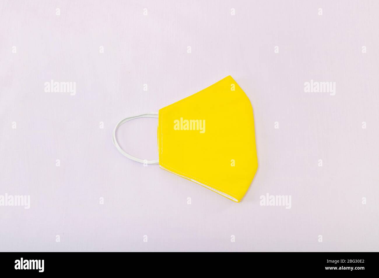 Download The Yellow Clothes Mask On White Background Stock Photo Alamy PSD Mockup Templates