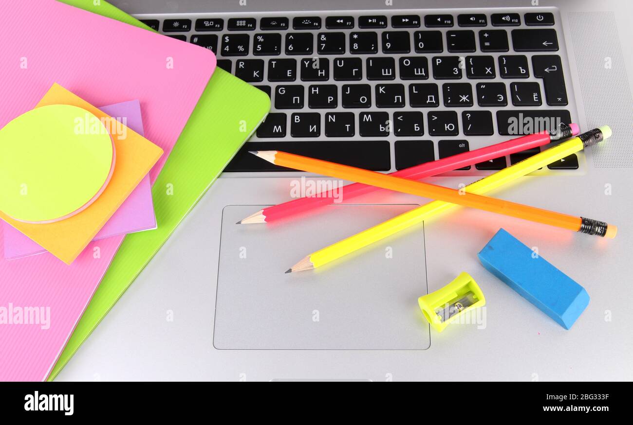 Laptop with stationery close-up Stock Photo