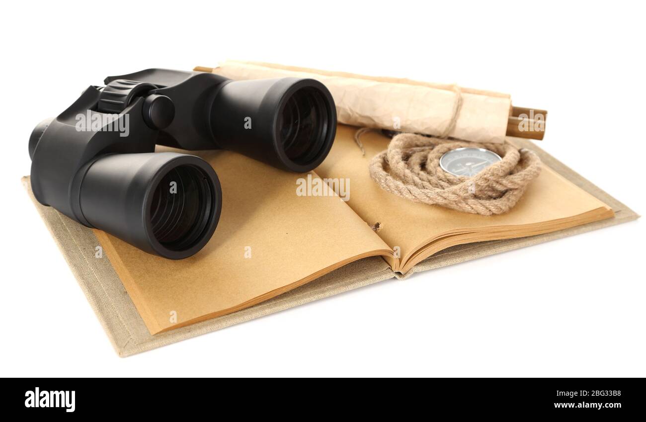 Black modern binoculars with old notebook isolated on white Stock Photo