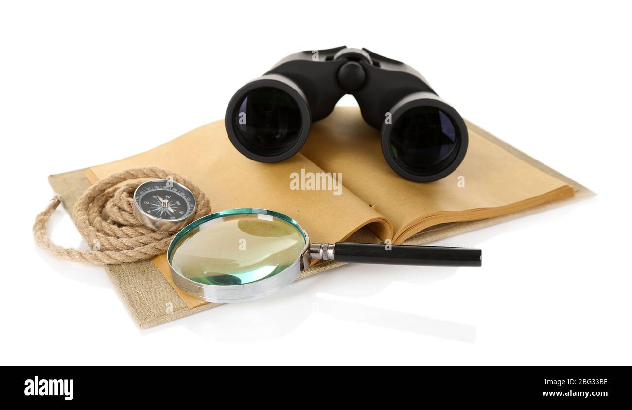 Black modern binoculars with old notebook isolated on white Stock Photo