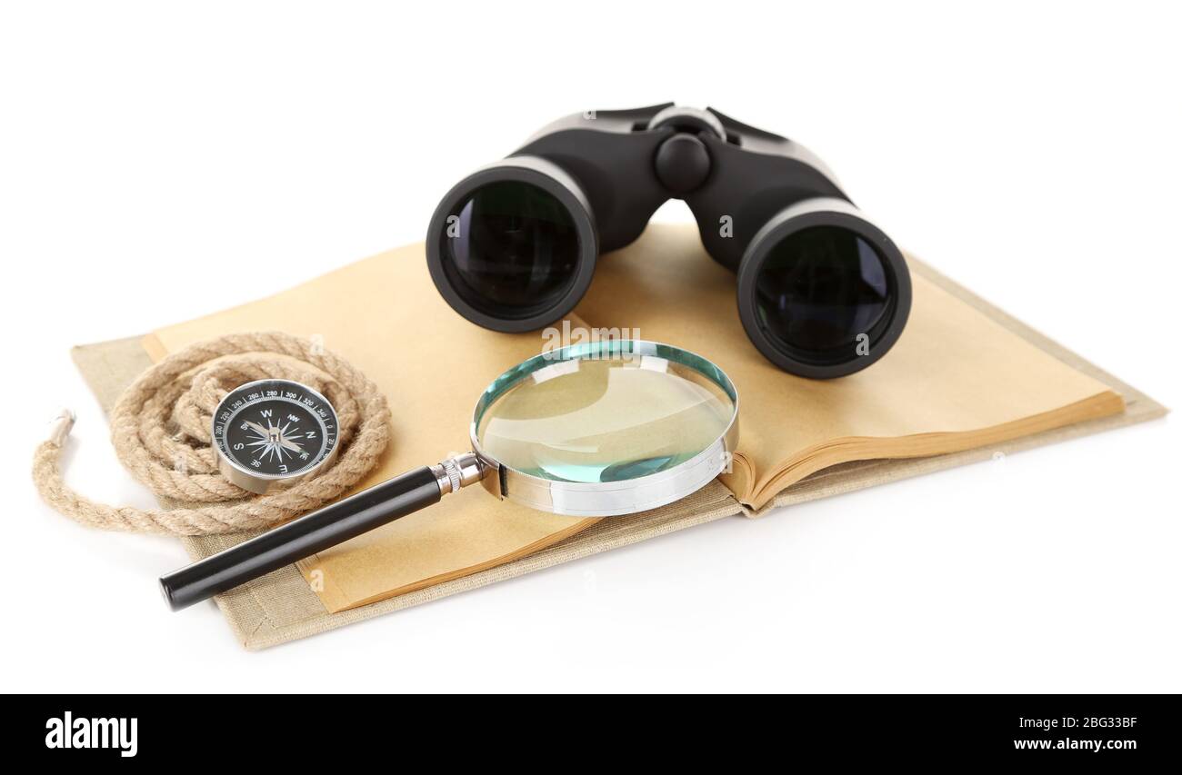Black modern binoculars with old notebook isolated on white Stock Photo