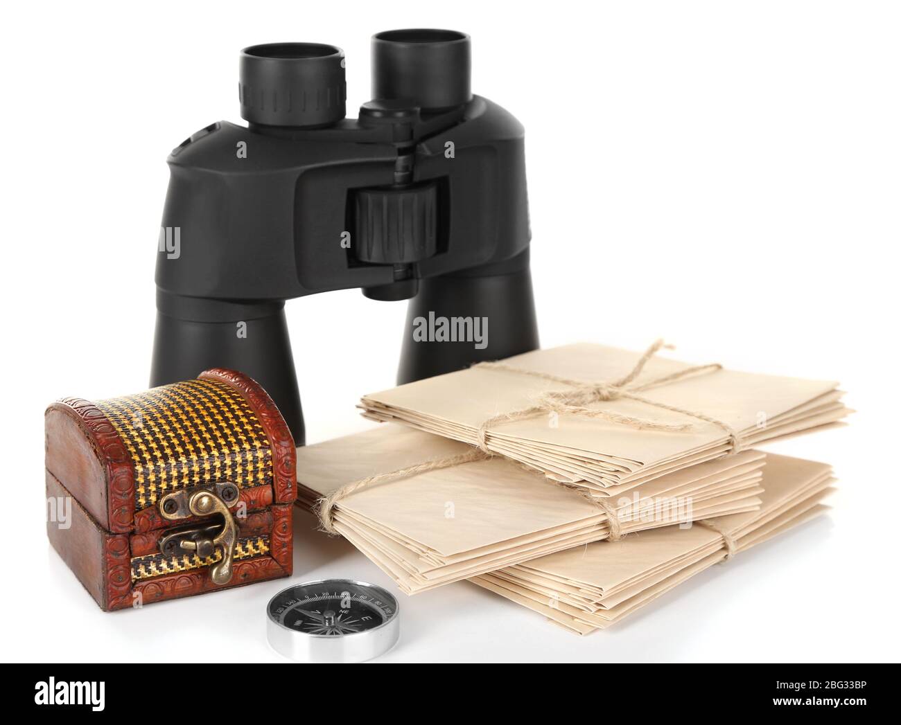 Black modern binoculars with old letters isolated on white Stock Photo