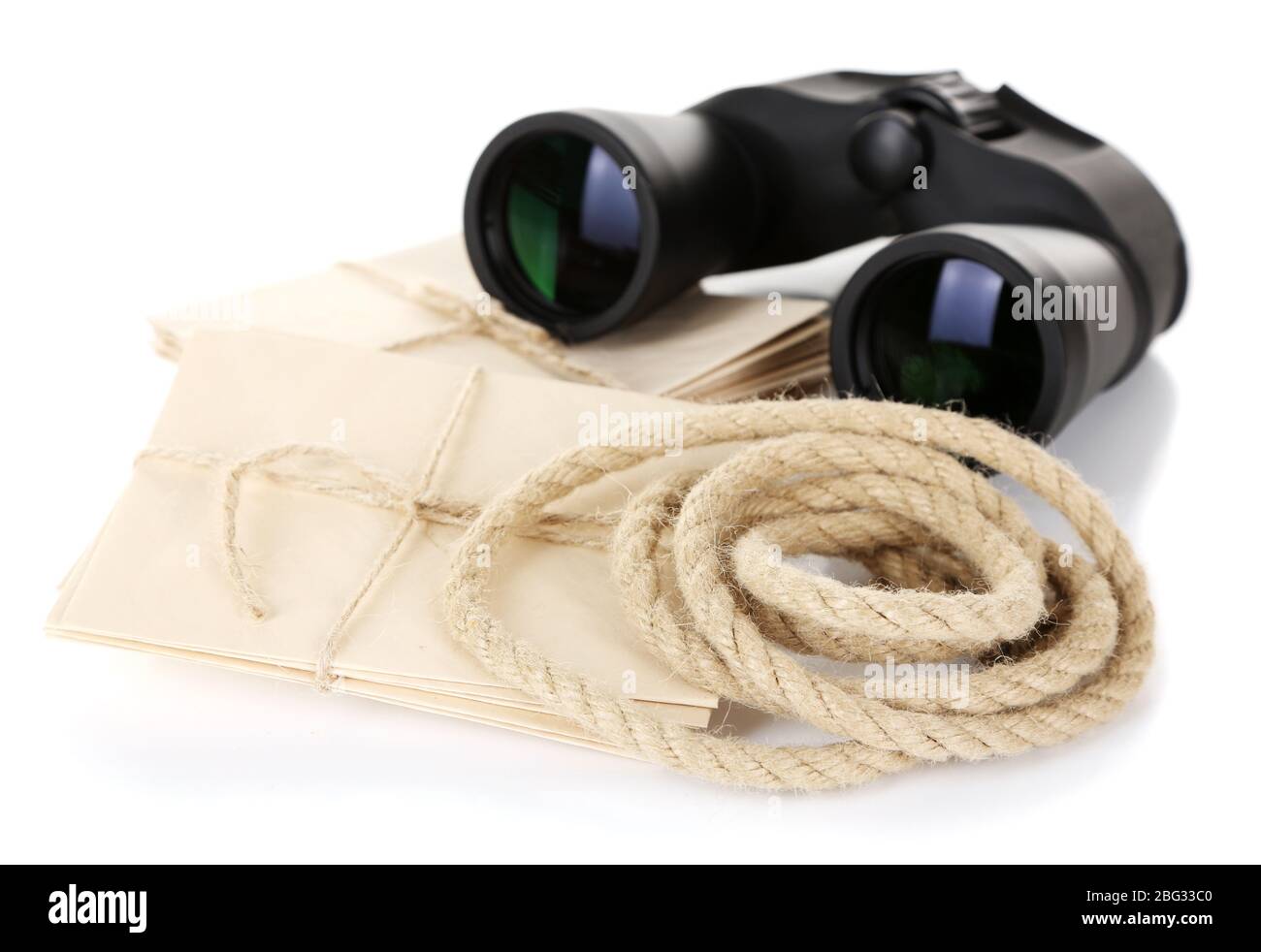 Black modern binoculars with old letters isolated on white Stock Photo