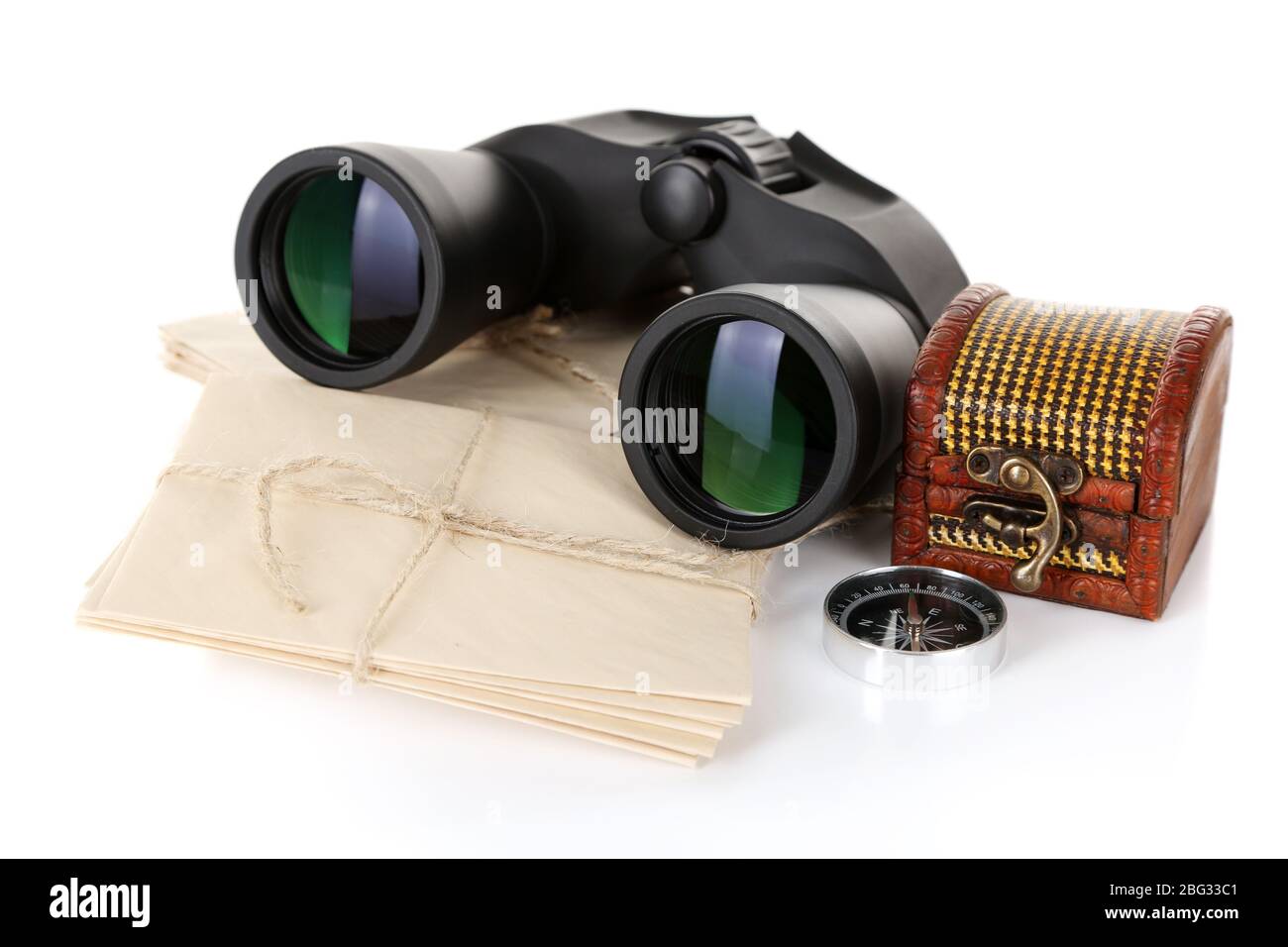 Black modern binoculars with old letters isolated on white Stock Photo