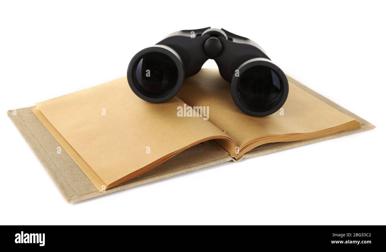 Black modern binoculars with old notebook isolated on white Stock Photo