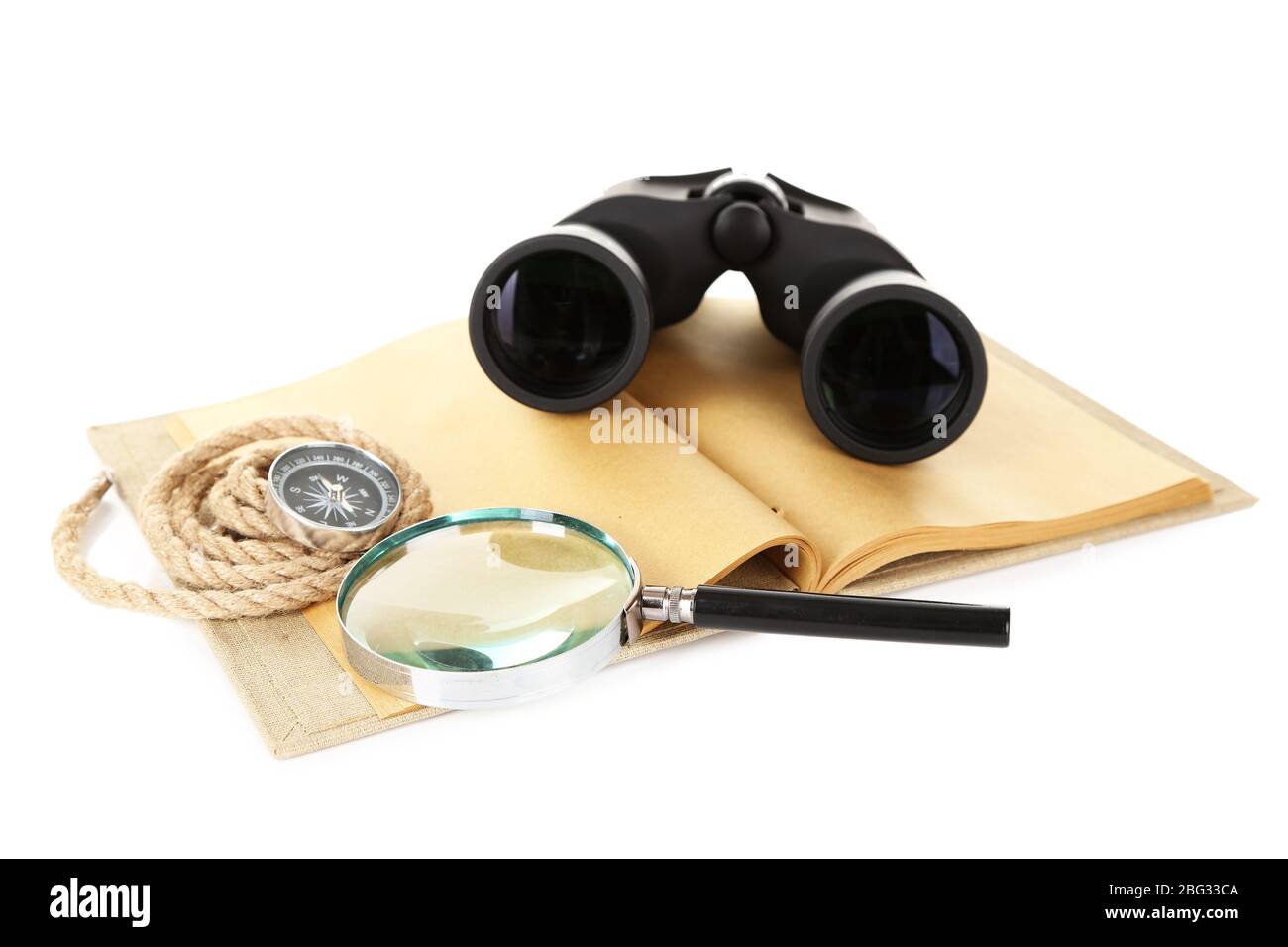 Black modern binoculars with old notebook isolated on white Stock Photo