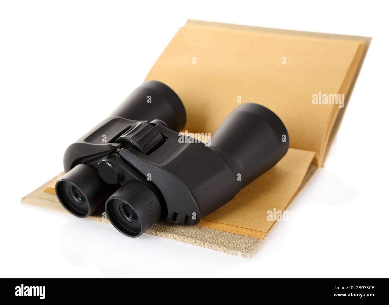 Black modern binoculars with old notebook isolated on white Stock Photo