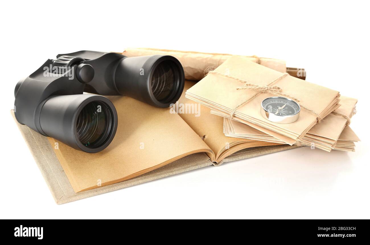Black modern binoculars with old notebook isolated on white Stock Photo