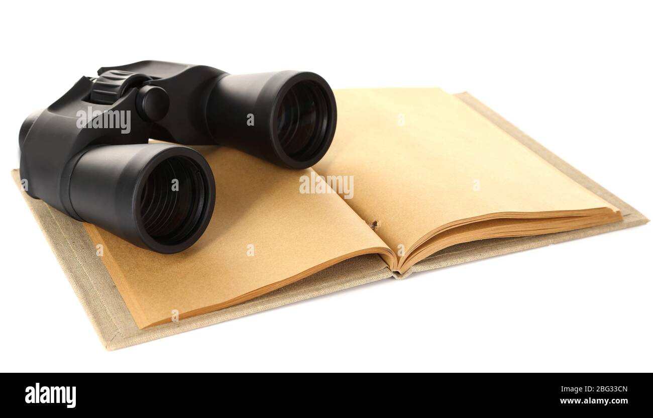 Black modern binoculars with old notebook isolated on white Stock Photo