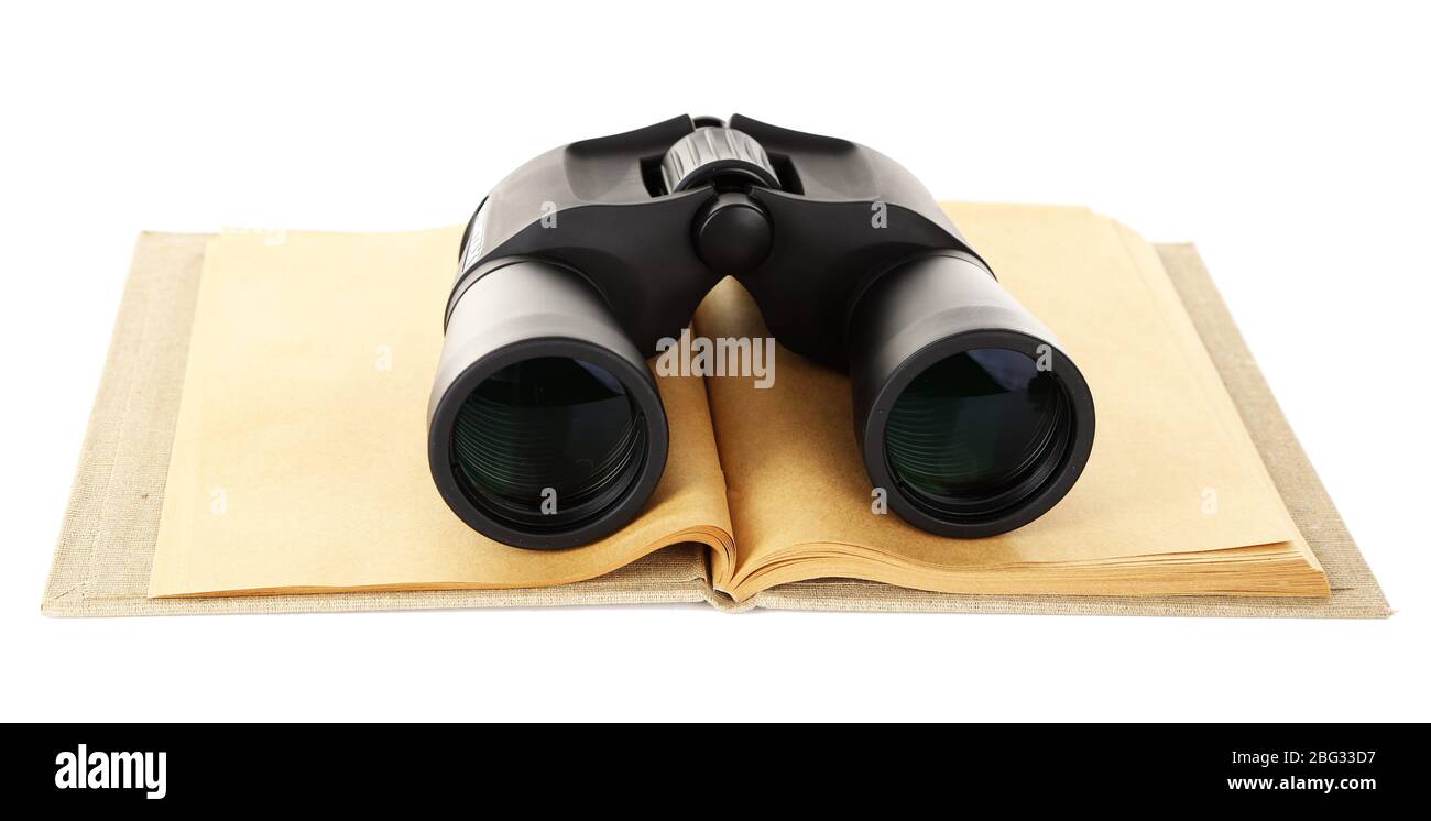 Black modern binoculars with old notebook isolated on white Stock Photo