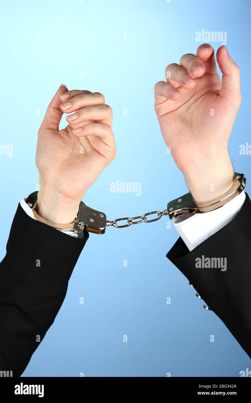 Man and woman hands and breaking handcuffs on color background Stock
