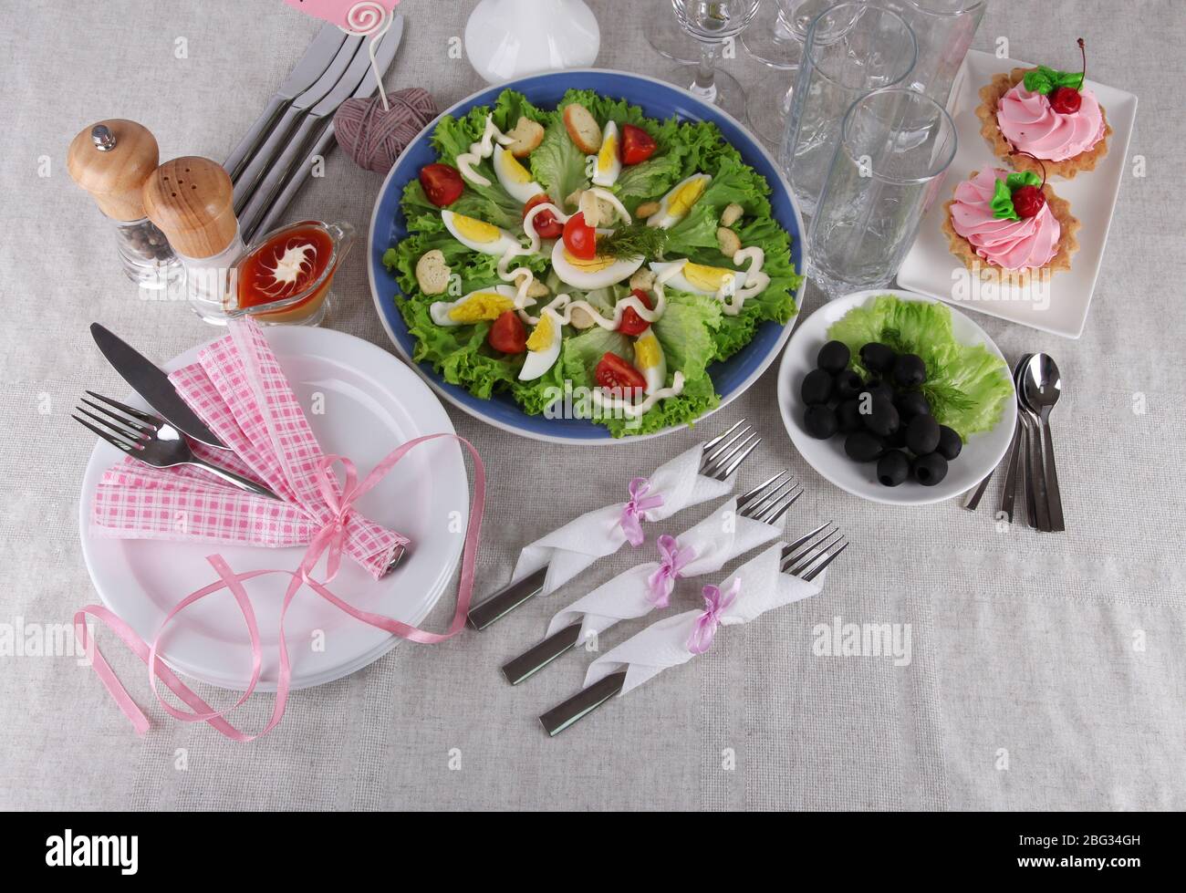 Table setting on tablecloth Stock Photo - Alamy