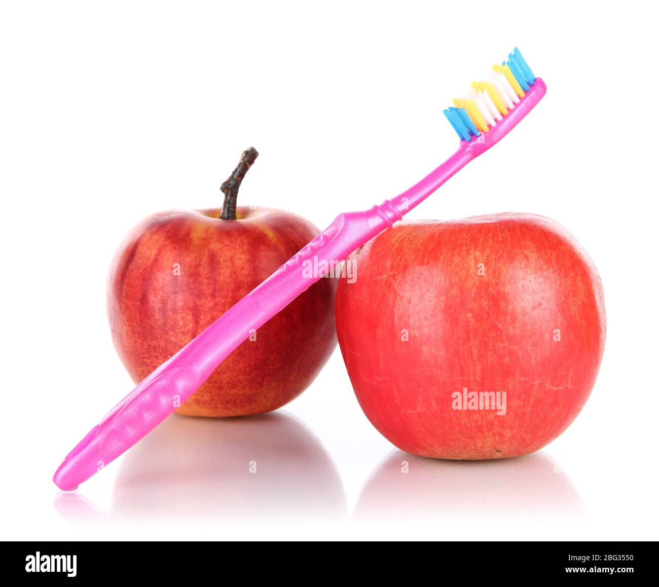 Apples with a toothbrush isolated on white Stock Photo - Alamy