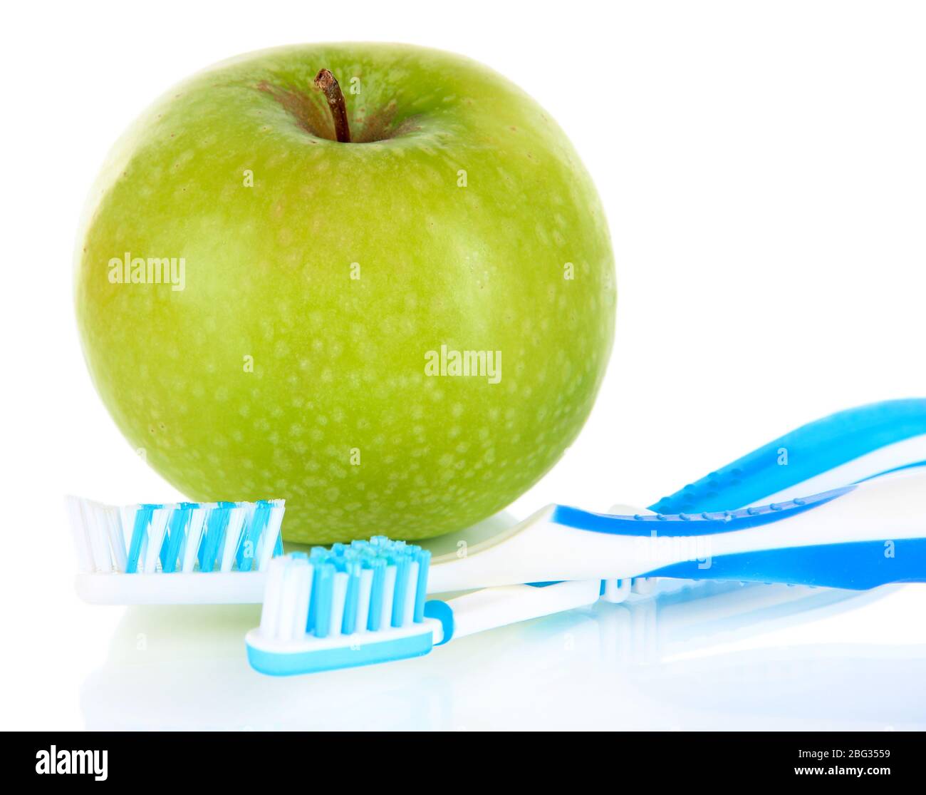Apple with a toothbrush isolated on white Stock Photo - Alamy