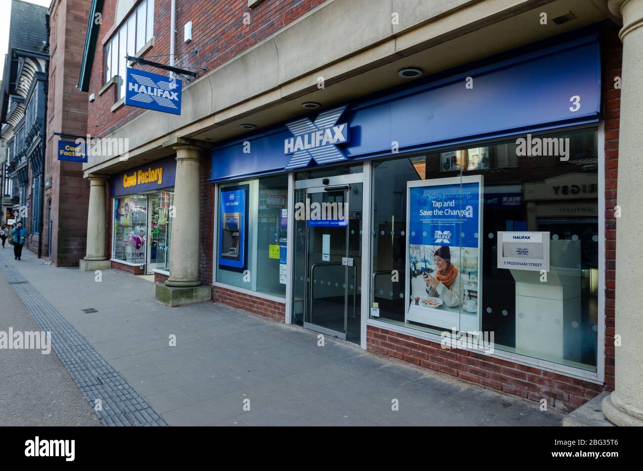 Chester, UK: Mar 1, 2020: The Halifax Building Society branch on Frodsham Street displays a poster to promote their Save the Change money savings sche Stock Photo