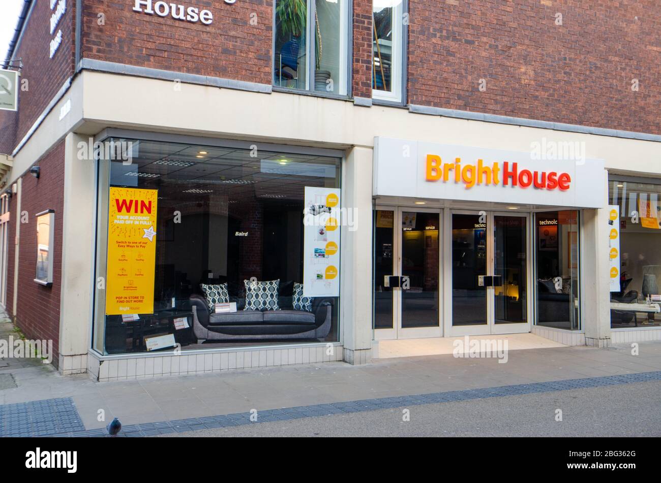 Chester, UK: Mar 1, 2020: A poster promotes a competition to win your account paid off in full at the BrightHouse store on Frodsham Street. Stock Photo