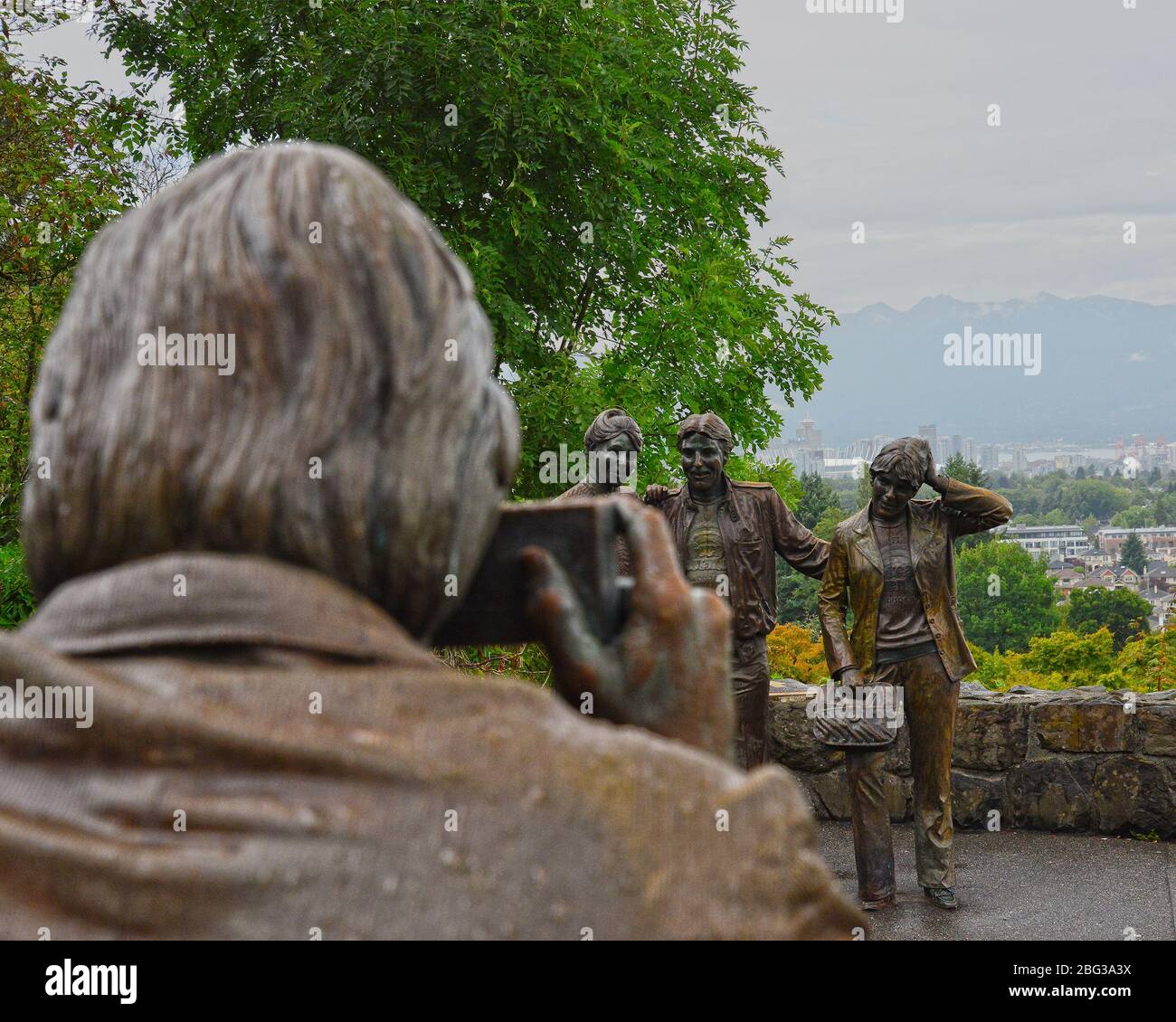 The J Seward Johnson sculpture called Photo Session in Queen Elizabeth