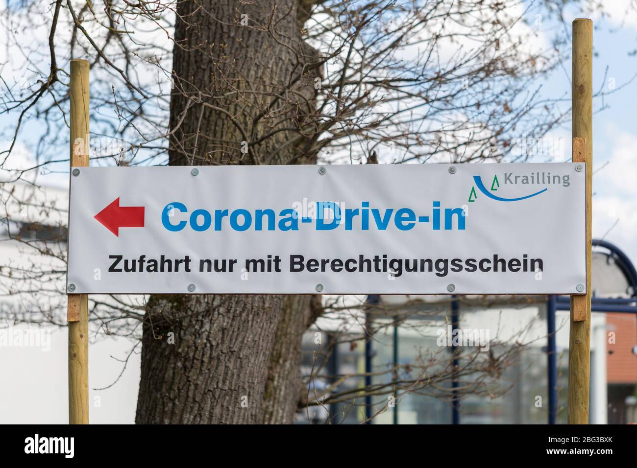 Corona Drive-In sign. The text below indicates that only entitled persons (with a document from a doctor) will be tested for the Coronavirus. Stock Photo