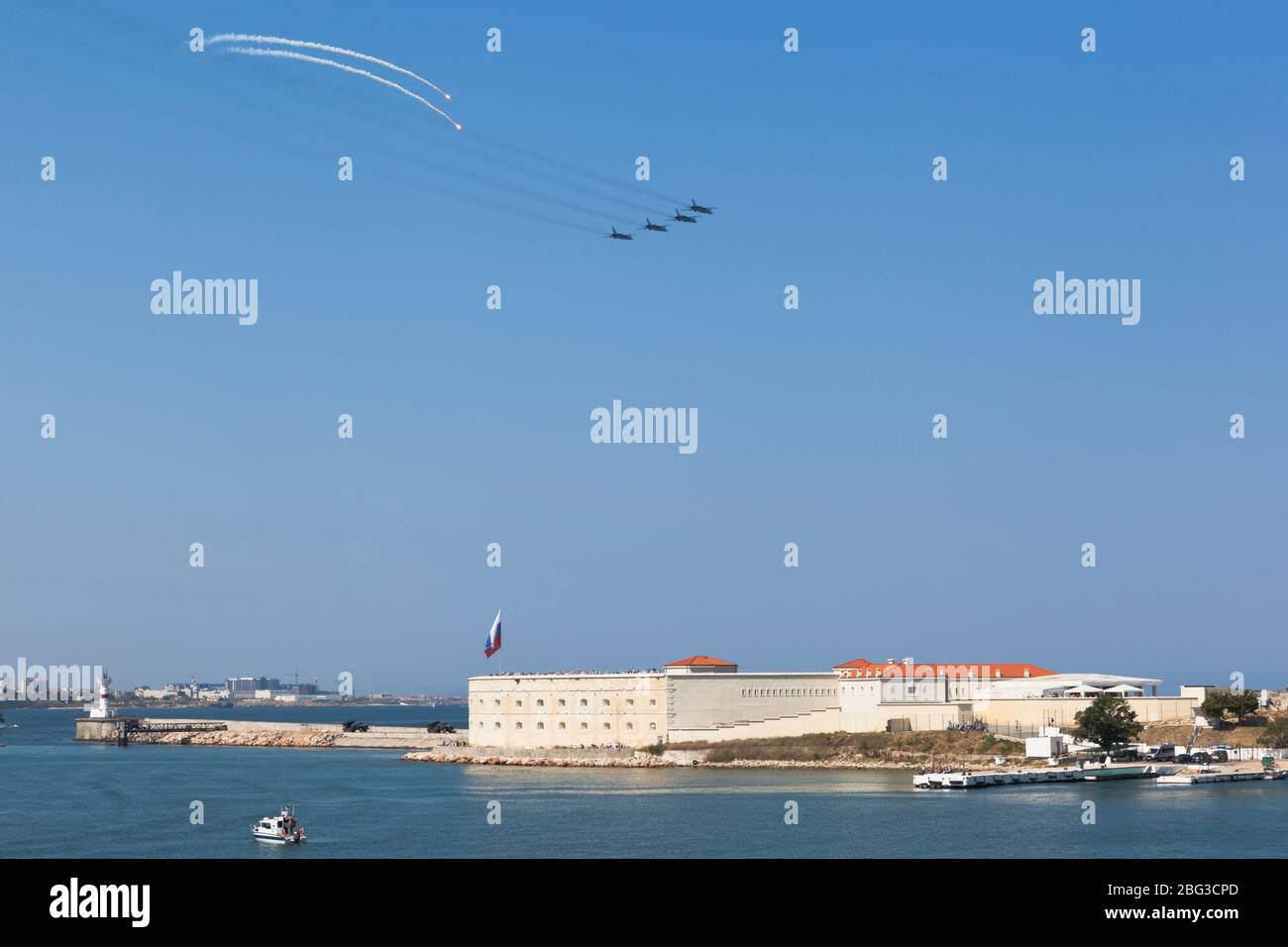 Sevastopol, Crimea, Russia - July 28, 2019: Su-24 aircraft fly over the Konstantinovsky battery at the parade in honor of the Navy Day in the city of Stock Photo