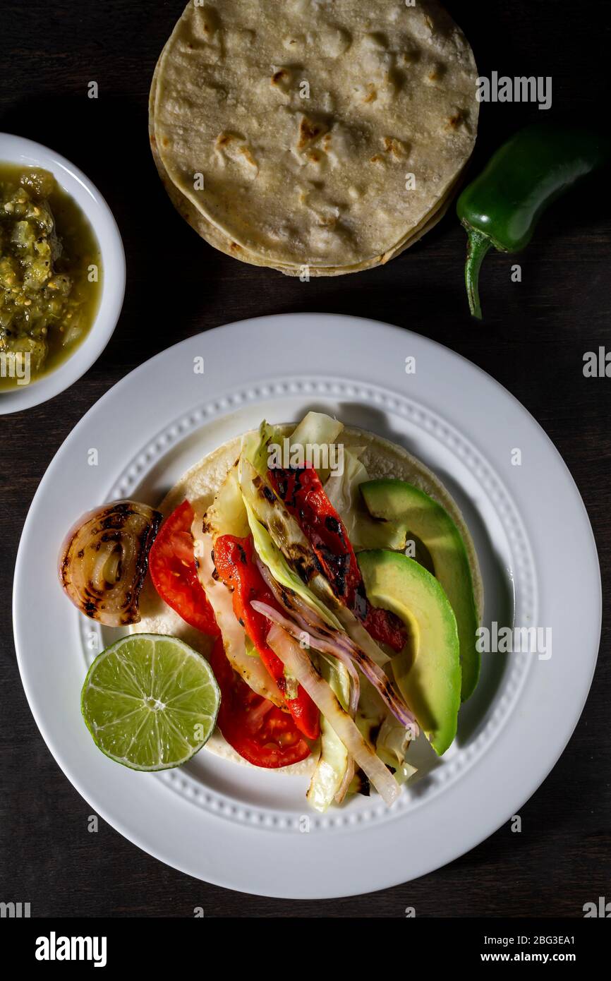 Vegan tacos. Grilled cabbage, onions and red peppers Stock Photo Alamy