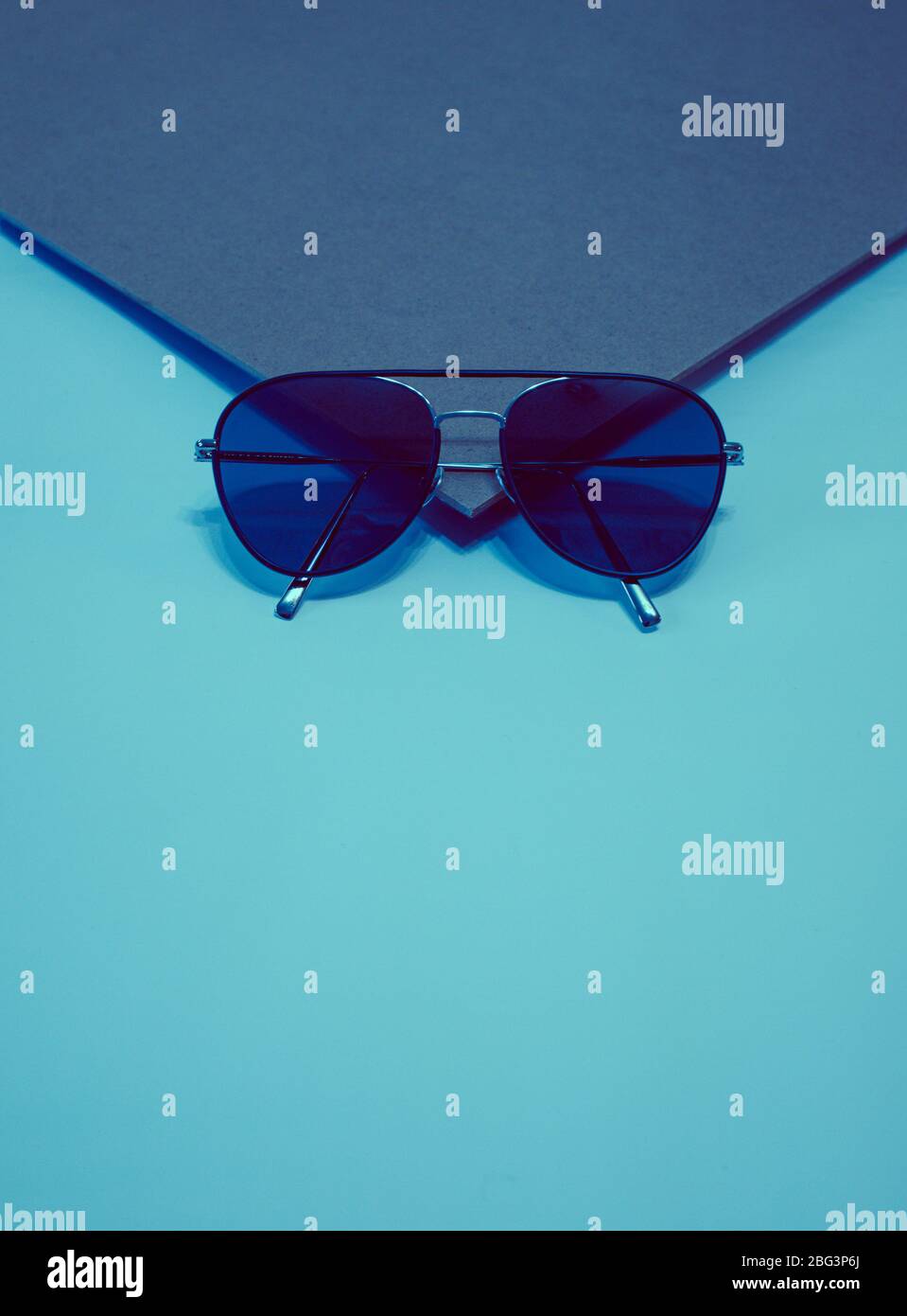 Sunglasses on the corner of a book Stock Photo