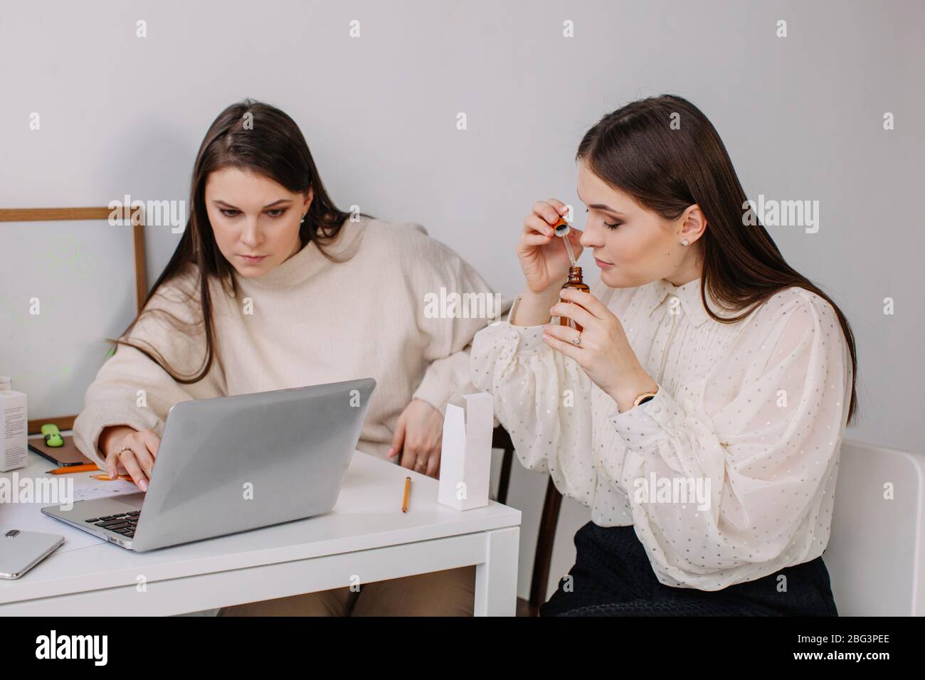 Two women working with essential oils Stock Photo