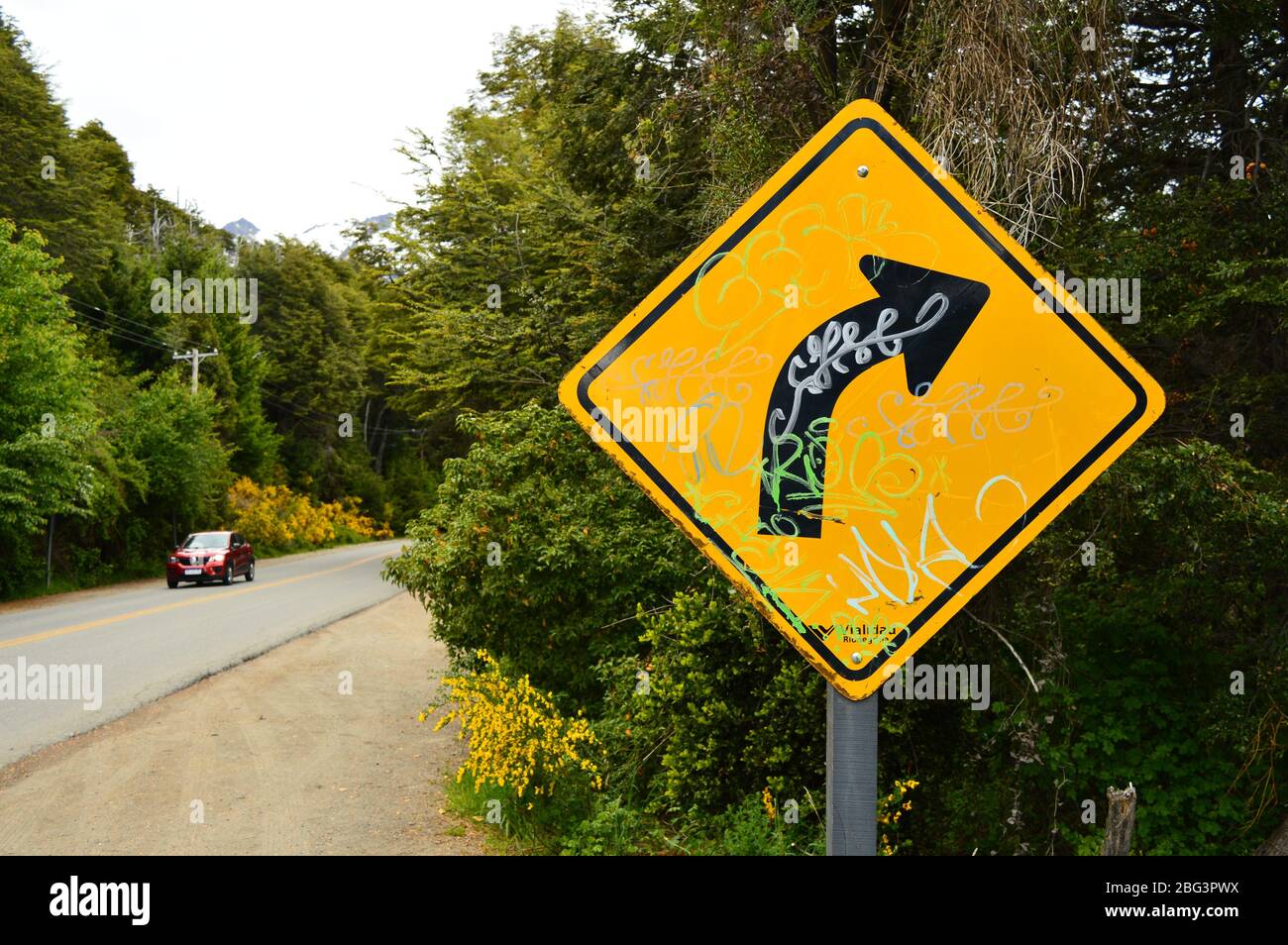 Graffitied Road Sign in Patagonia Stock Photo