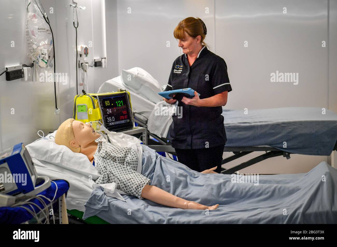 A simulation technician takes part in medical training inside a ward at the official opening of the new Dragon's Heart Hospital, built at the Principality Stadium, Cardiff, to care for coronavirus patients. Stock Photo