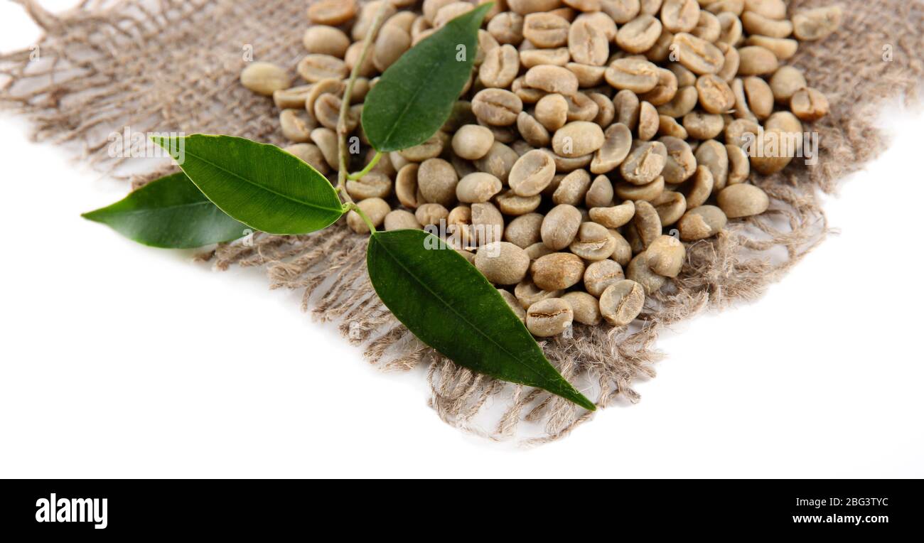 Green coffee beans and leaves isolated on white Stock Photo - Alamy