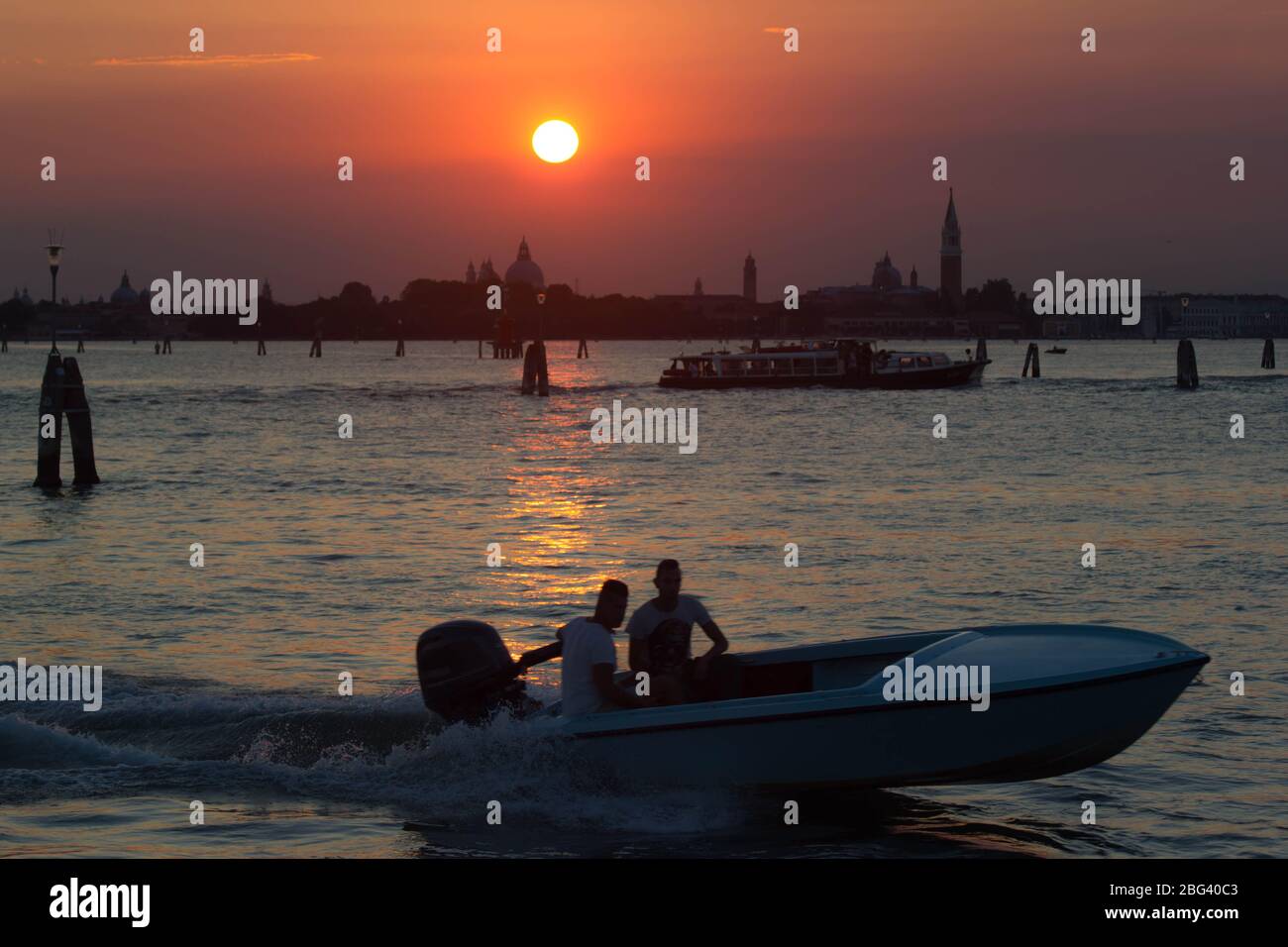 Speedboat Sunset over Venice Lido Stock Photo