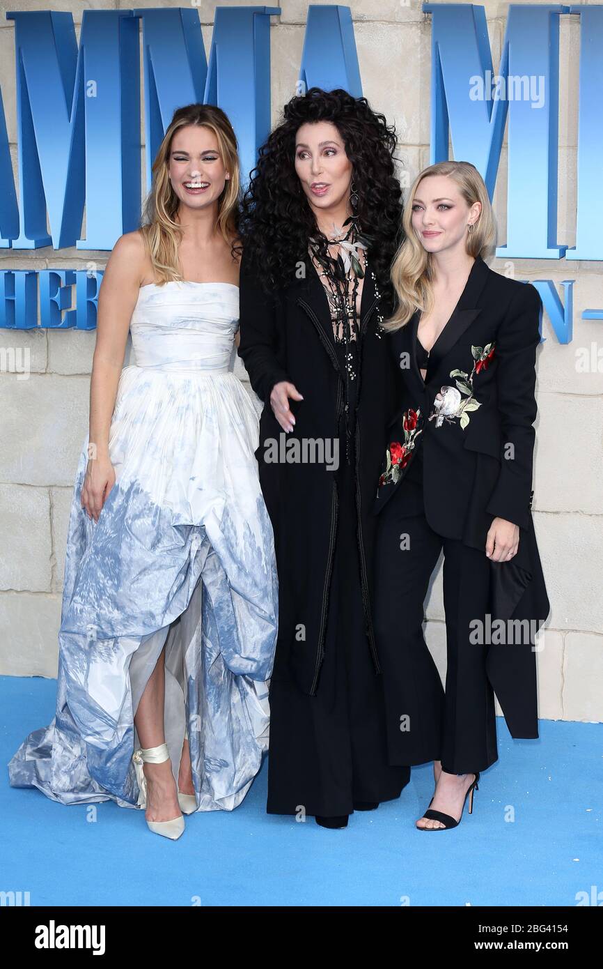 Lily James, Cher and Amanda Seyfried attend the UK Premiere of 'Mamma Mia! Here We Go Again' at Eventim Apollo on July 16, 2018 in London,UK. Stock Photo