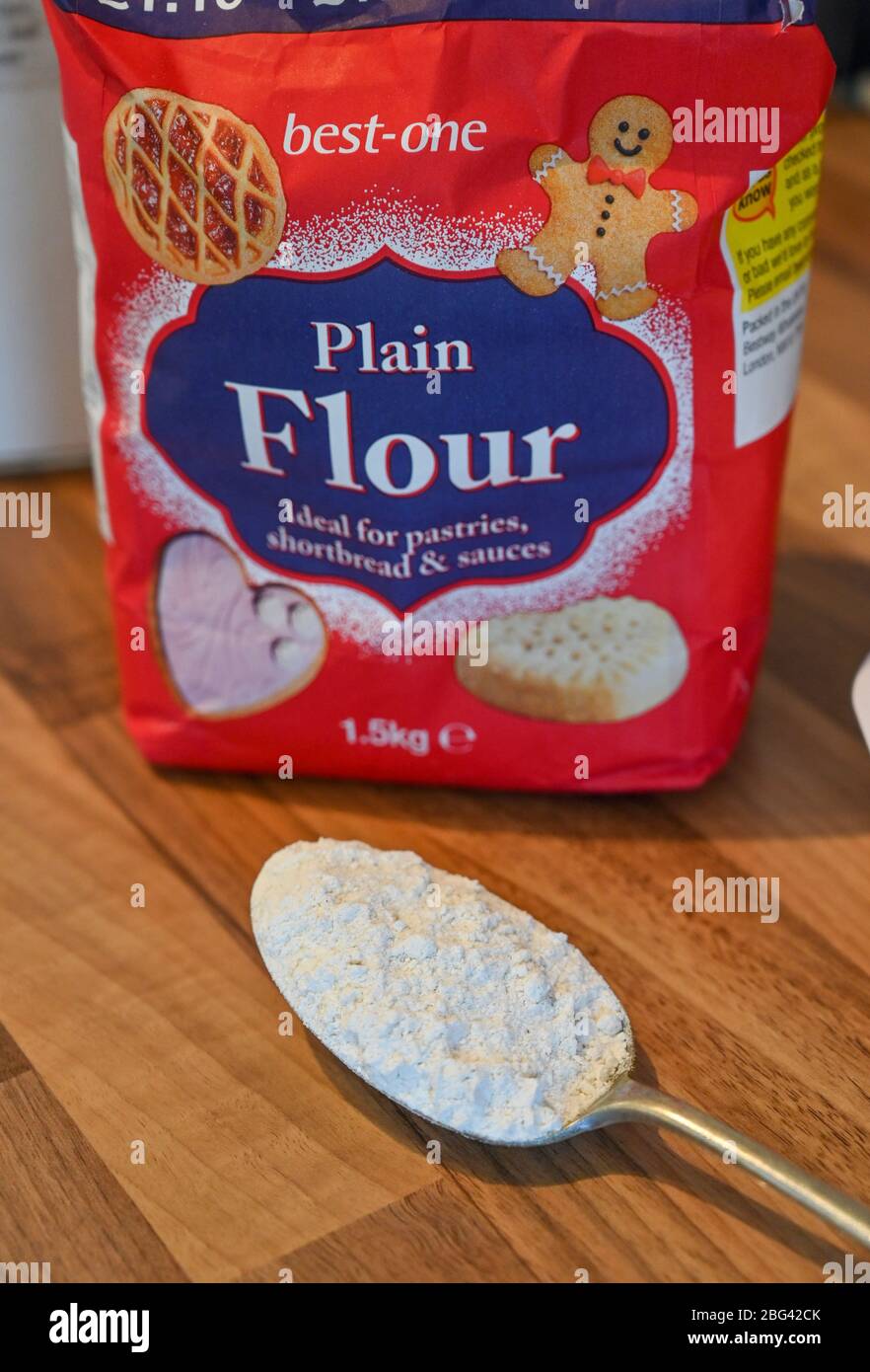 A bag and spoonful of best-one supermarket white plain flour which has been difficult to het hold of during the coronavirus outbreak Stock Photo