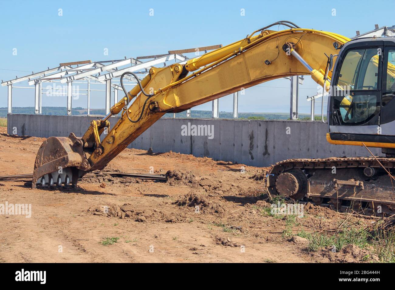 Excavator Performs Excavation Work In Clay Stock Photo, Picture and Royalty  Free Image. Image 99734842.