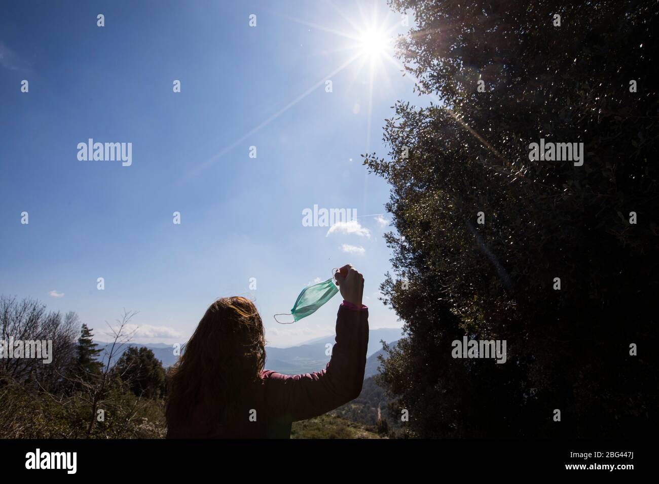 Woman removing covid mask hi-res stock photography and images - Alamy
