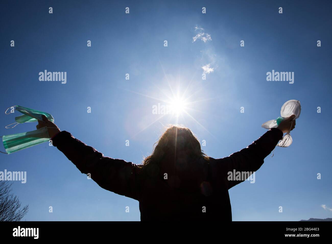 Mid adult woman removing mask hi-res stock photography and images - Alamy