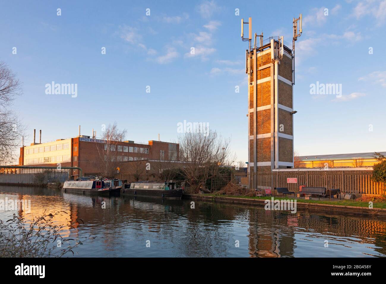 Grand Union Canal with Industrial Units and Fire Station, Park Royal, London, England, UK Stock Photo