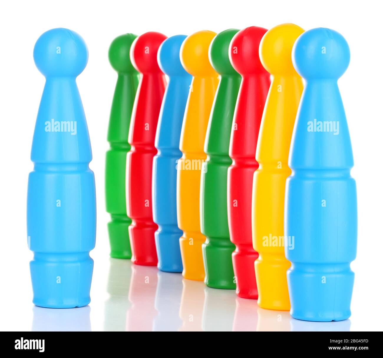 Colorful plastic skittles of toy bowling isolated on white Stock Photo