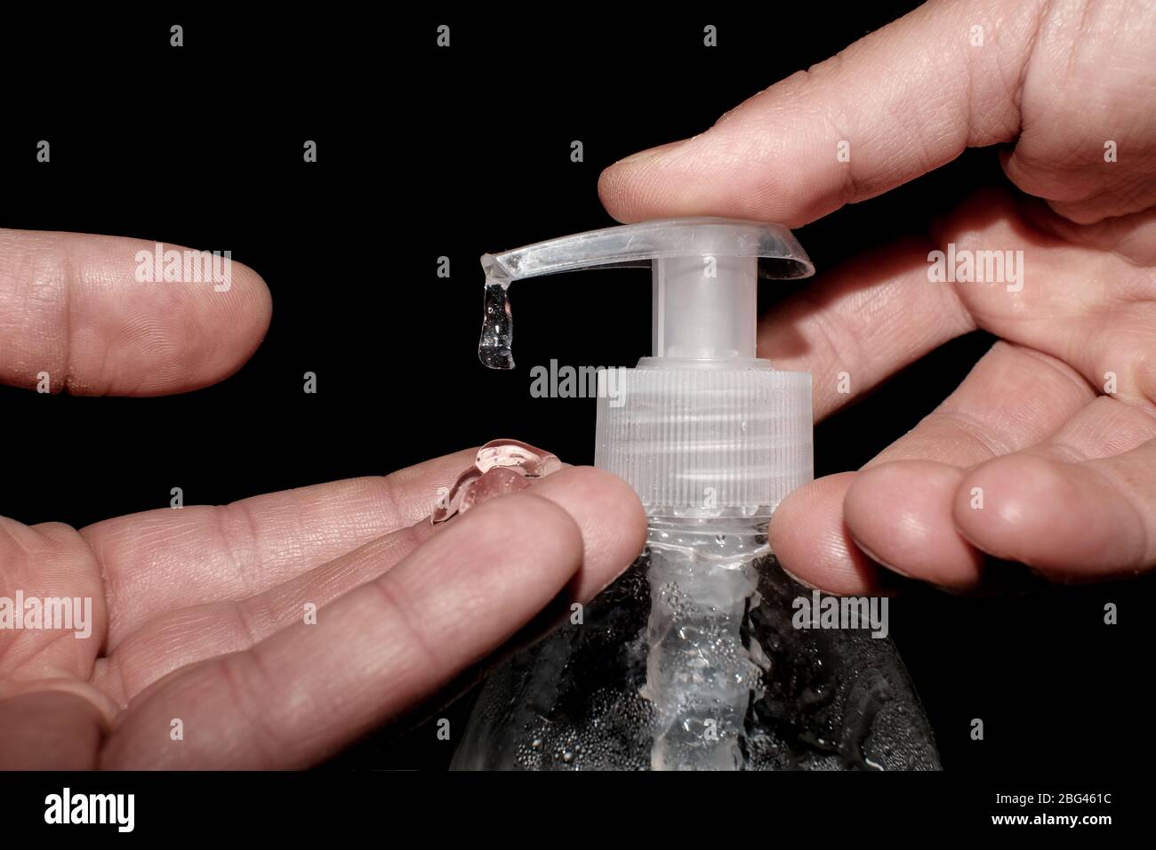 Man sanitize hand with alcohol hand sanitizer dispenser,corona virus covid19 infection disease Stock Photo