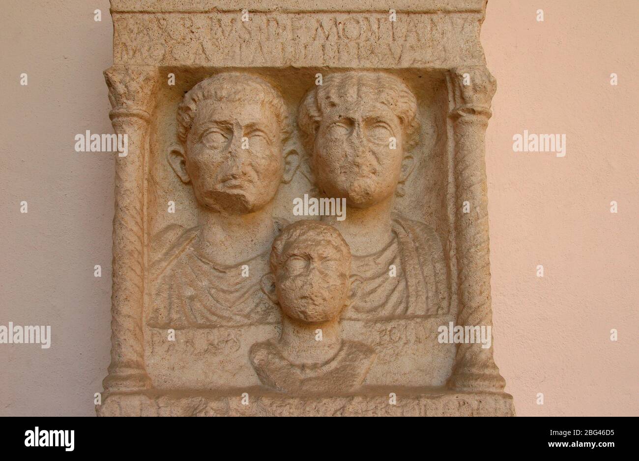 Roman stele. 1st CE.  Bust of Publio Arrio Montano, Mocazia Helpide (wife) Pubio Arrio Polluce son with 'bulla'). Ravenna. Itay. Stock Photo