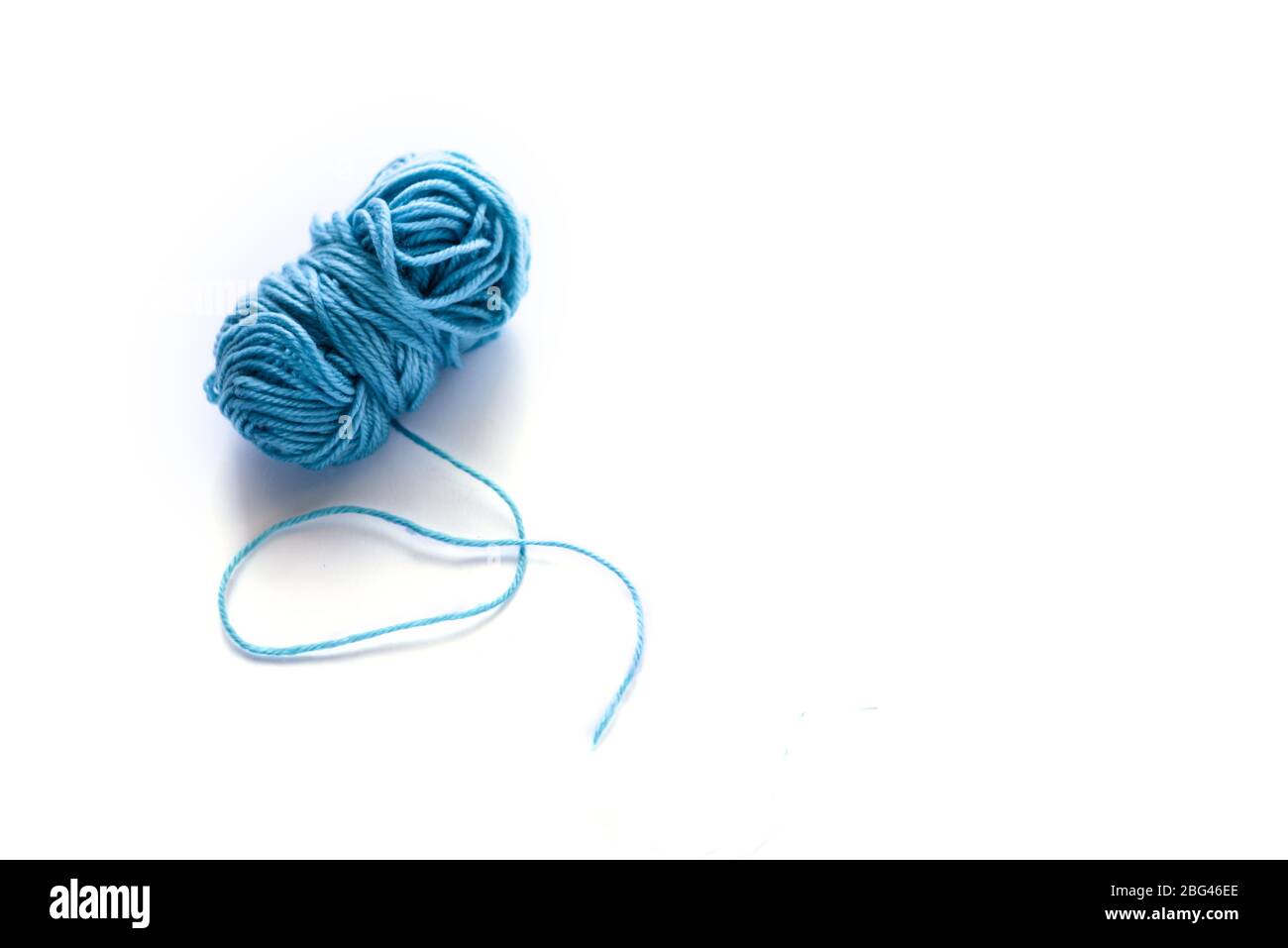 Colored blue wool isolated on the white background. Stock Photo