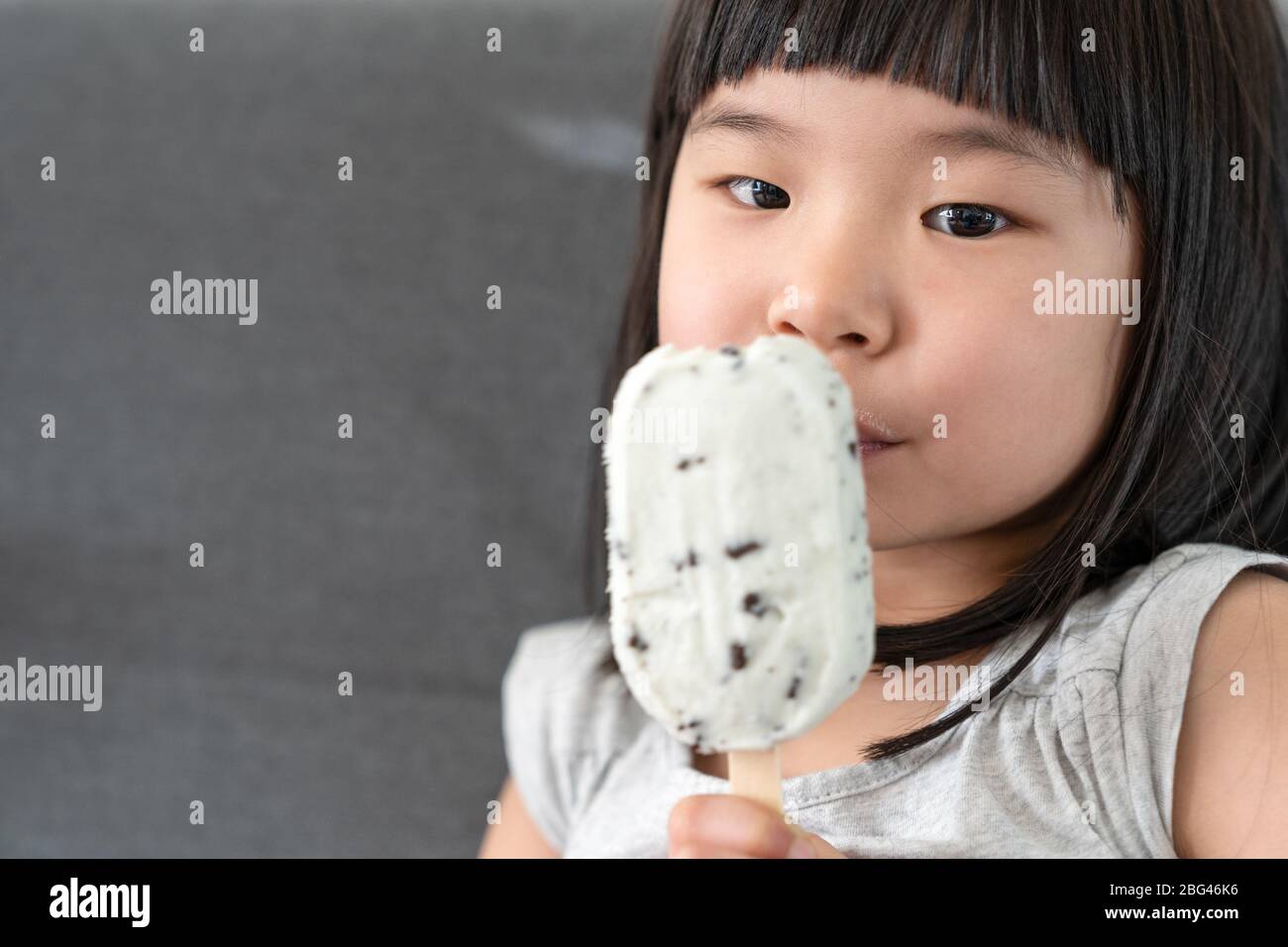 Cute toddler girl eating ice cream Stock Photo Alamy