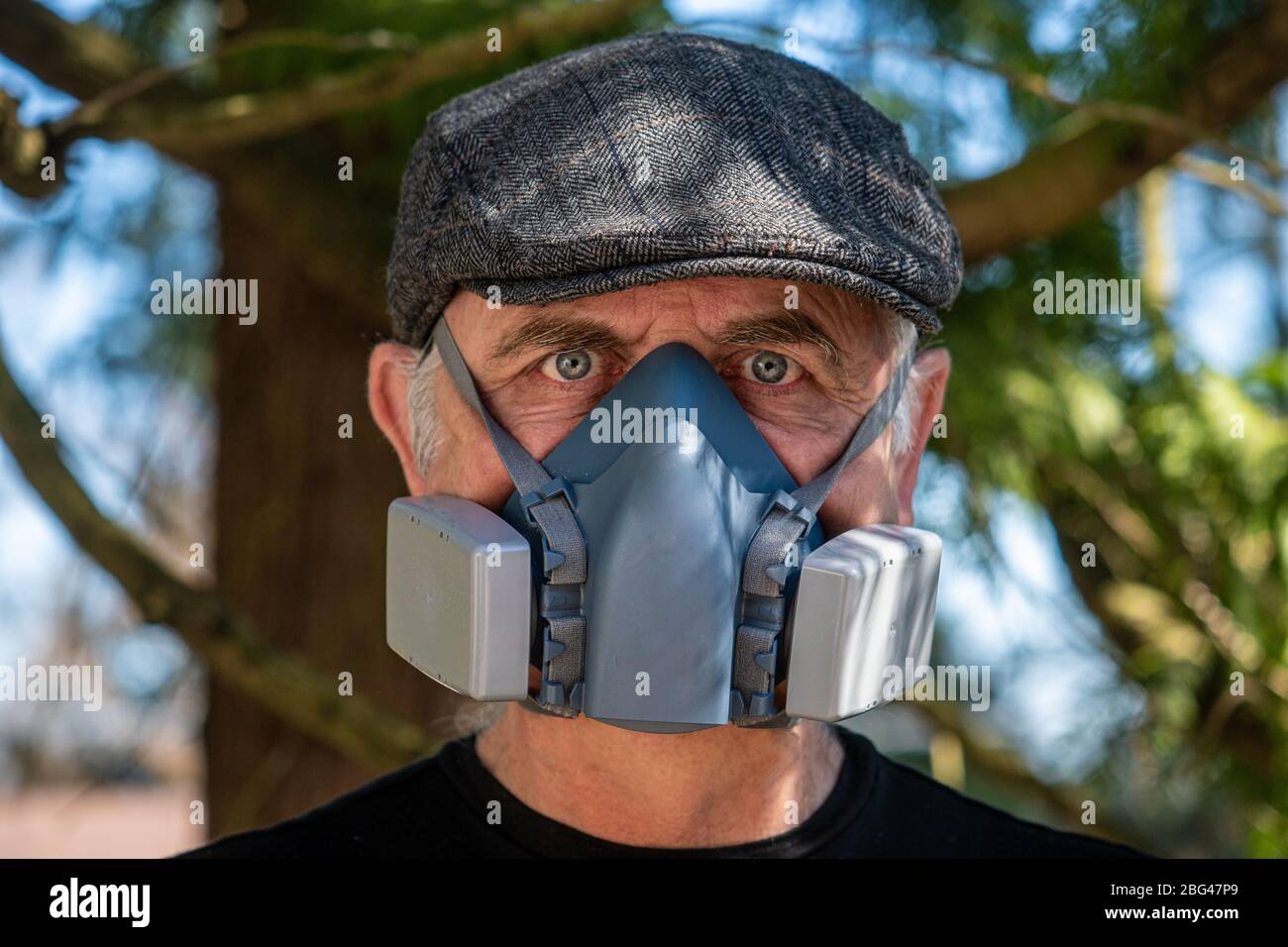 Portrait of a man wearing a HEPA filter mask Stock Photo - Alamy