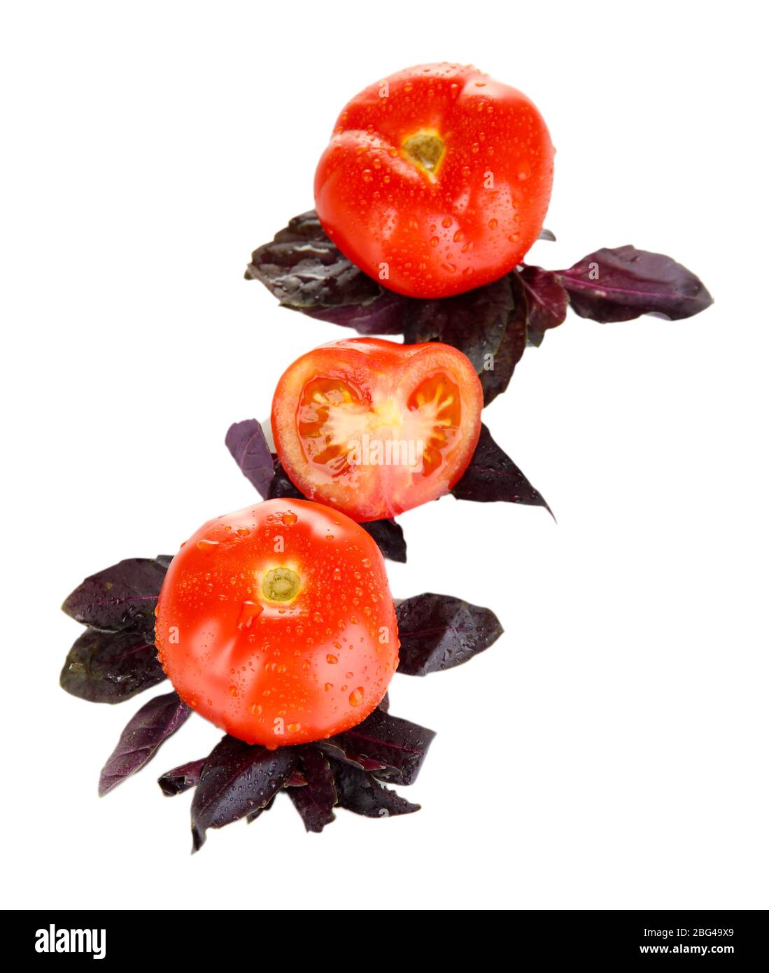 Fresh tomatoes and basil leaves isolated on white Stock Photo - Alamy