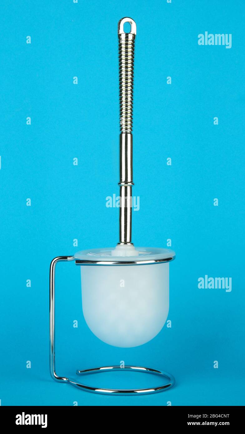Toilet brush on blue background Stock Photo - Alamy