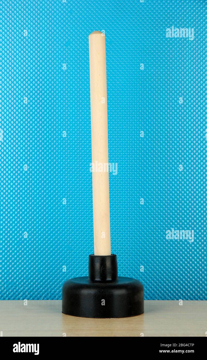 Toilet plunger on blue background Stock Photo Alamy