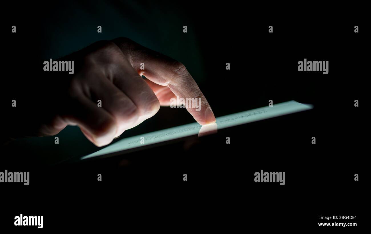 Close up Silhouette Man Hand Touching a Touch Screen Device on Black ...