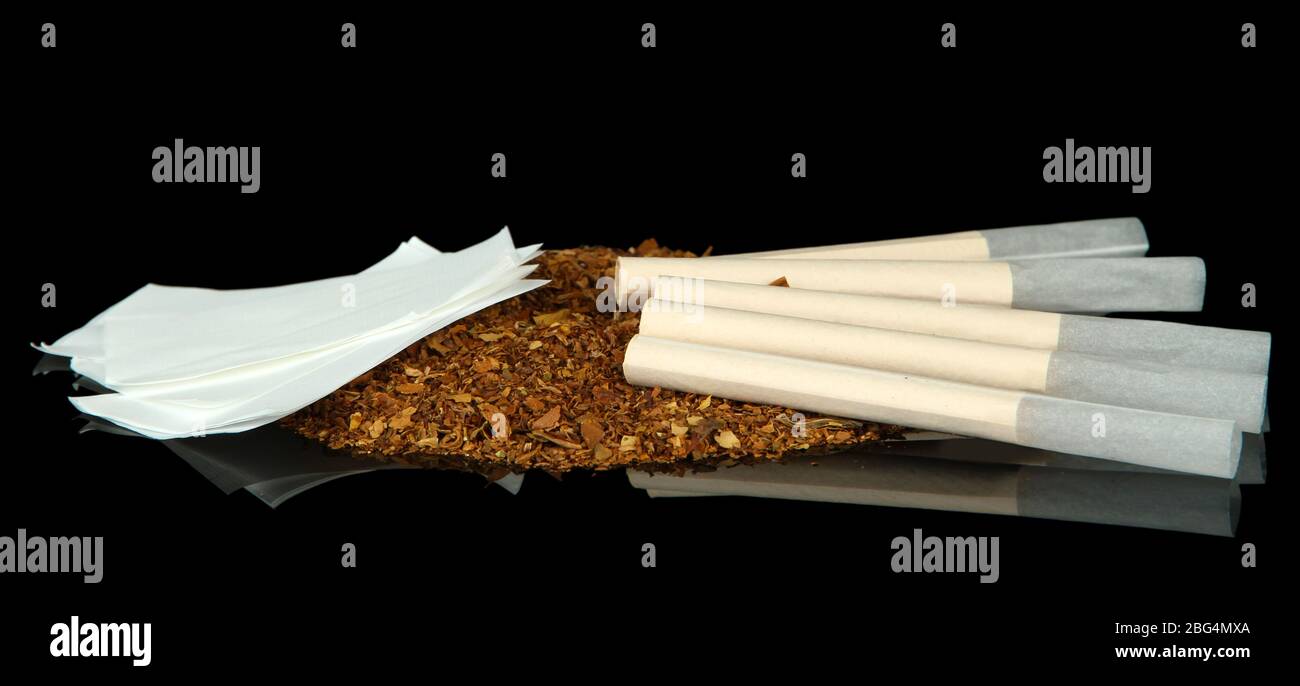 Tobacco and cigarette tubes, isolated on black Stock Photo Alamy