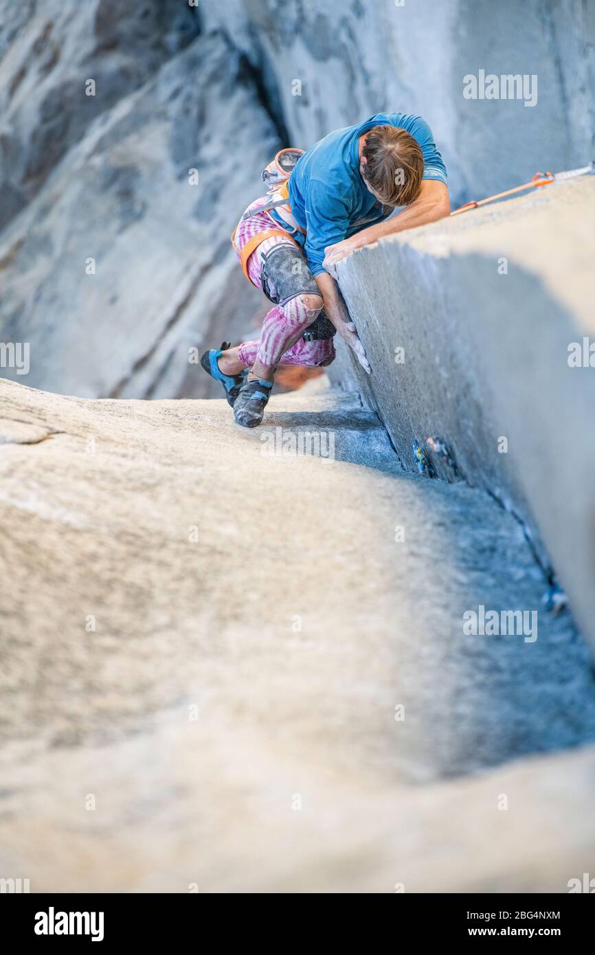Athlete rock climbing the crux pitch of the Nose on el Capitan Stock